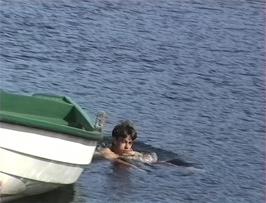 Graham is first to swim around the boat in the icy waters of Jølstravatnet at Vassenden Picnic Area